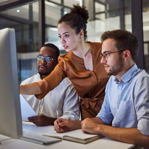 Learning, computer and training business interns in night office with manager, boss and leadership help. Men with technology planning ideas, kpi strategy and marketing innovation vision with mentor.